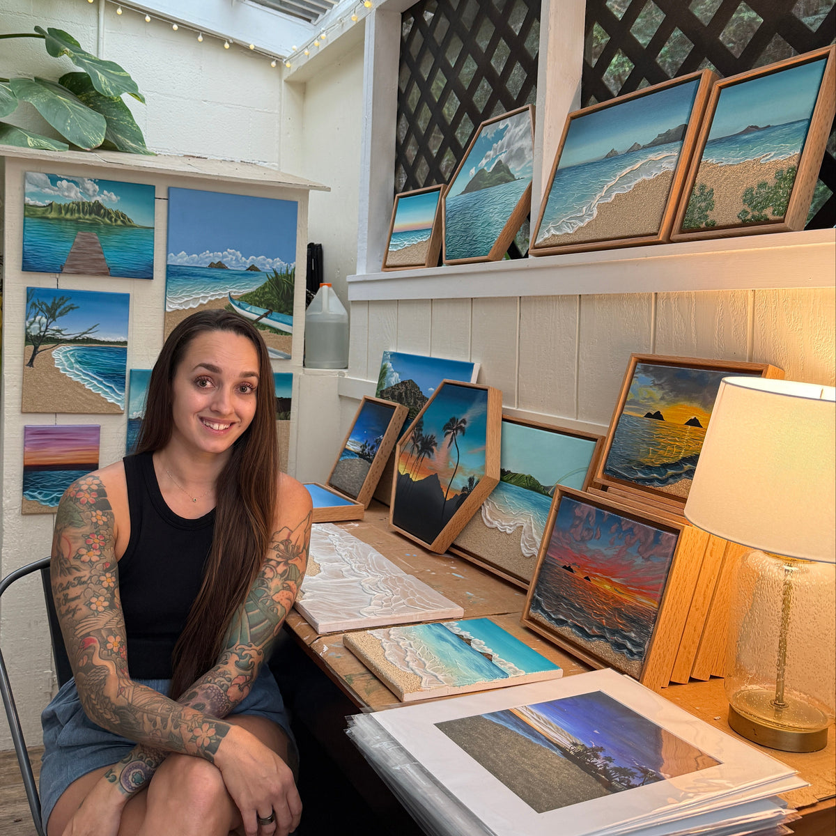 Rachel, the artist, with her collection of originals paintings, November 2025